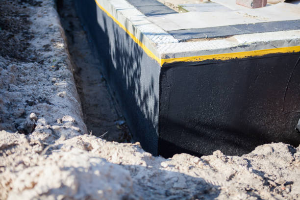 Professional Waterproofing technician working in Jasper, MI